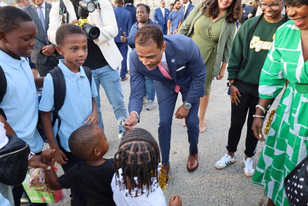 Tony Watlington giving kids a high five