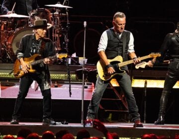 Nils Lofgren and Bruce Springsteen perfrom