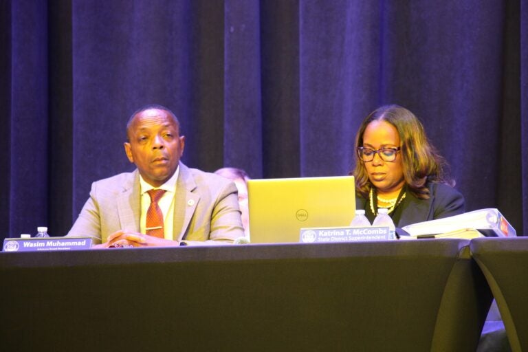 Wasim Muhammad looking on as people call on him to step down from the Camden City School District Advisory Board.