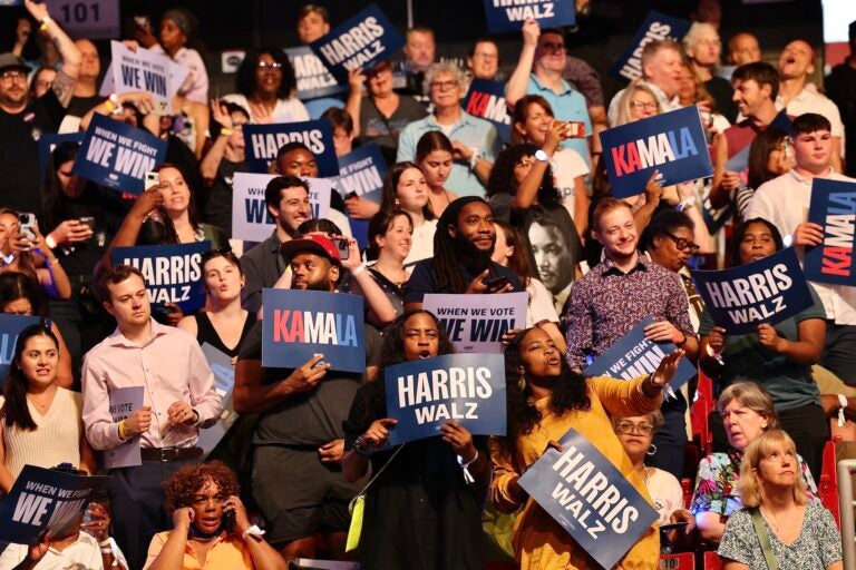 Excited supporters in the crowd at the Harris rally