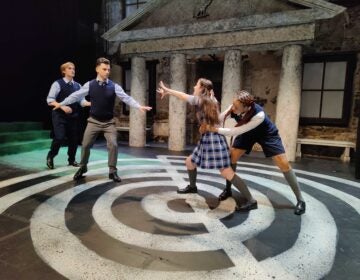 Actors at Hedgerow Theatre perform a fight scene from ''A Midsummer Night's Dream,'' set in a boarding school and reimagined with same-sex romantic partners by Mauckingbird Theatre. (Peter Crimmins/WHYY)