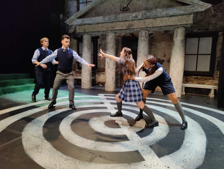 Actors at Hedgerow Theatre perform a fight scene from ''A Midsummer Night's Dream,'' set in a boarding school and reimagined with same-sex romantic partners by Mauckingbird Theatre. (Peter Crimmins/WHYY)