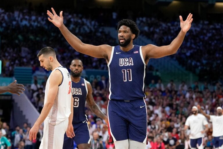 Joel Embiid with his hands up