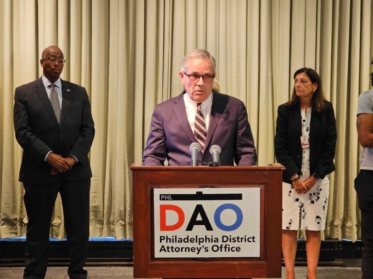 Larry Krasner behind a podium