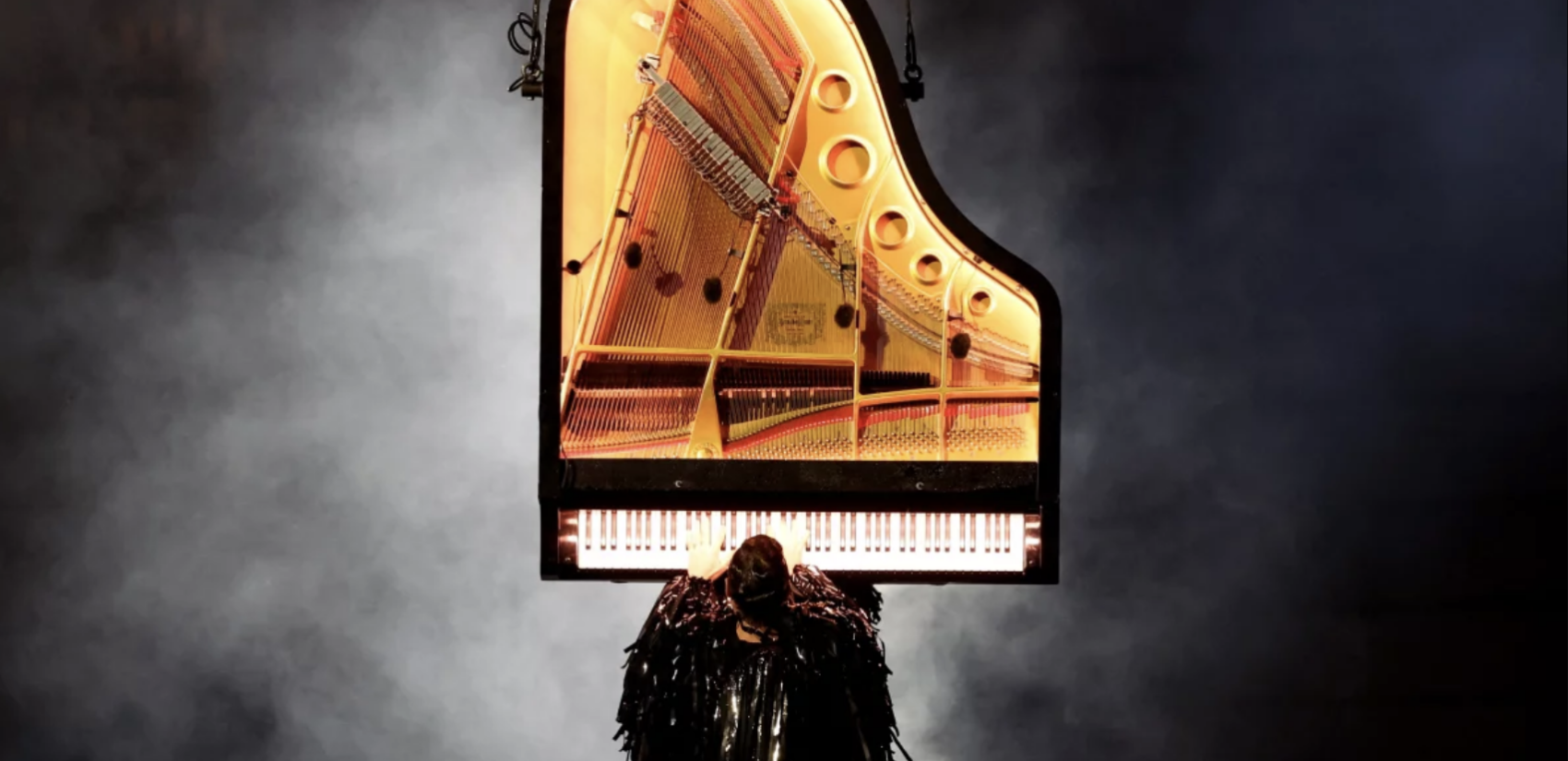 A pianist performs during the closing ceremony on Sunday.