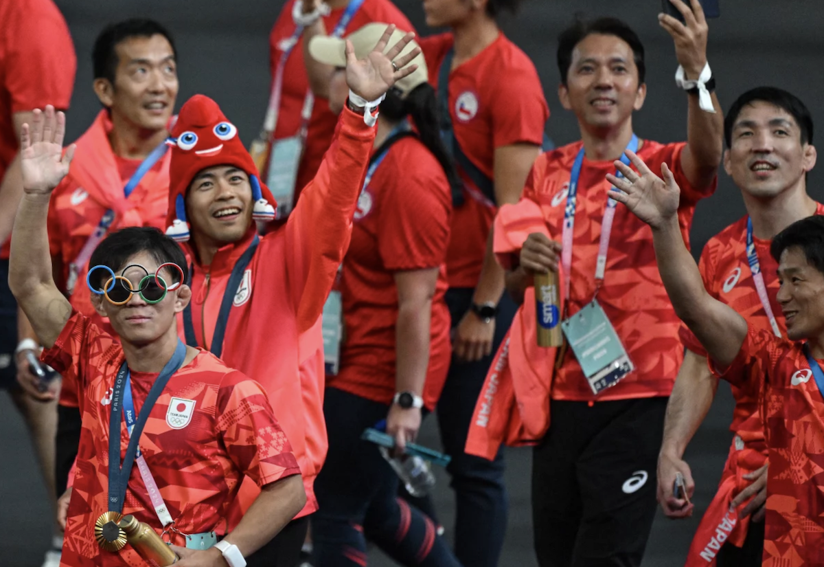 Japan's athletes take part in the athletes parade during the closing ceremony on Sunday.