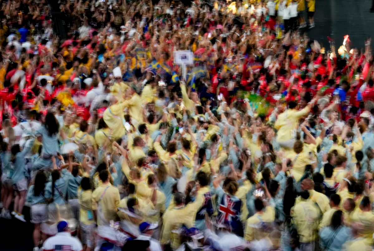 Olympic athletes parade on Sunday.