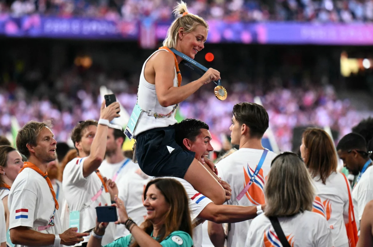 Gold medalist of women's marathon swimming, the Netherlands' Sharon Van Rouwendaal, celebrates with her medal on Sunday.