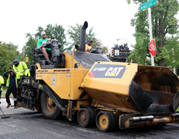 Workers are seen repaving a Philadelphia street