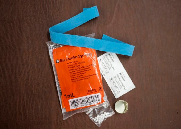 Syringes, alcohol swabs, and other supplies sit on a table in Western Pennsylvania.