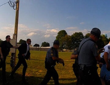 Officers run with guns drawn