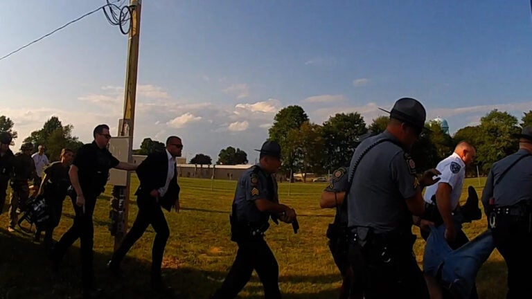 Officers run with guns drawn