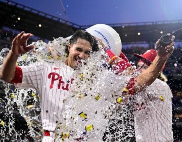 Tyler Phillips being doused with liquid