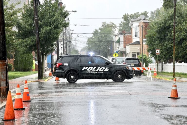 A Woodlynne Police Department cruiser is seen in the rain