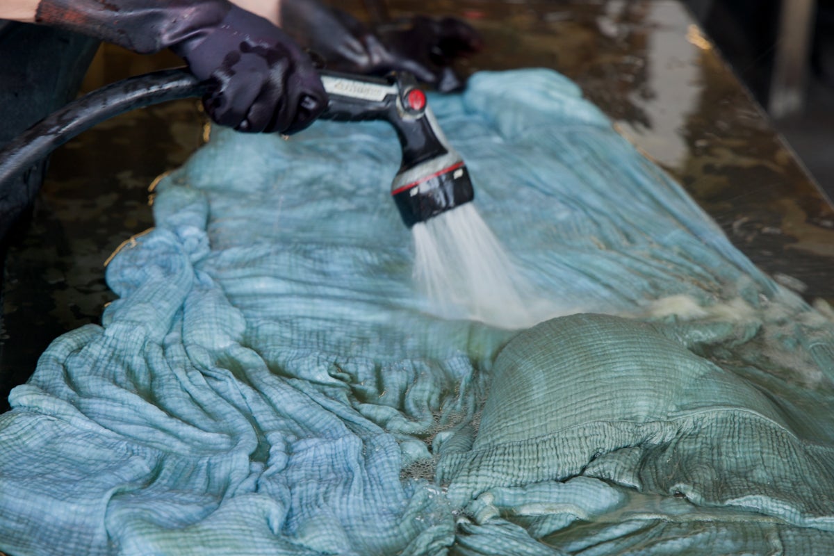 a hose spraying a dress