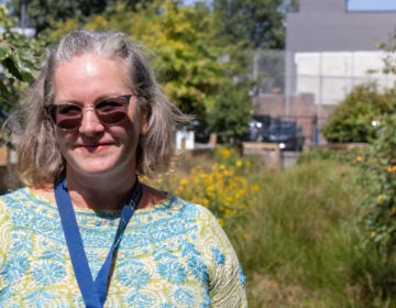 Emma-Lynn Melvin smiles in the rain garden