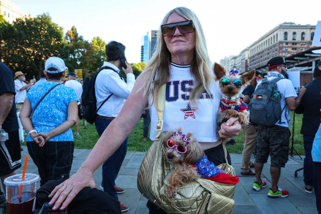 Lori Ney with her dog at the rally