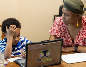 Constance Jones and her son, Austen, during a typical day of online learning with PA Cyber. (Kimberly Paynter/WHYY)