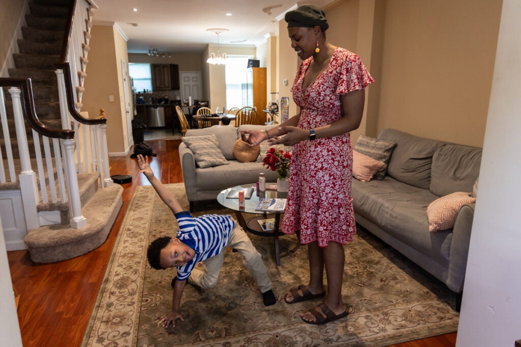 Constance Jones and her son, Austen, take a break from home schooling to play together.