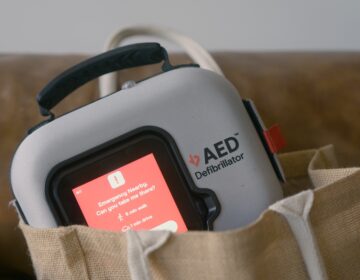 An automated external defibrillator (AED) is a medical device that evaluates a person's heart rhythm and delivers an electrical shock to help restore a normal rhythm during cardiac arrest. (Courtesy of Avive Solutions)