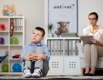 Psychologist is looking at a child with autism spectrum disorder. (Bigstock/Kasia Bialasiewicz)