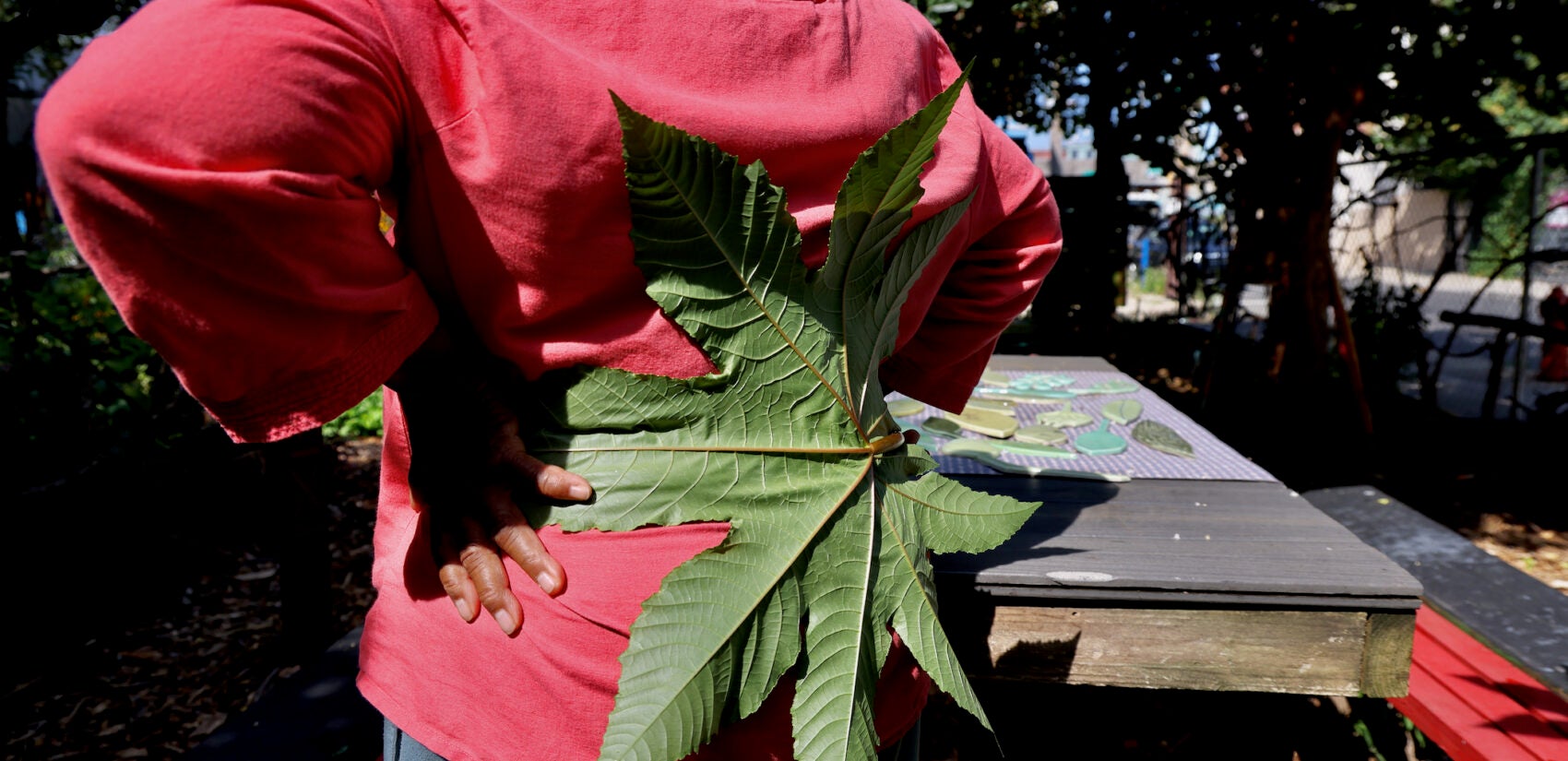 Iris Brown holds a leaf behind her back