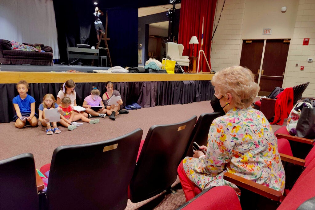 Children perform during a rehearsal of the play