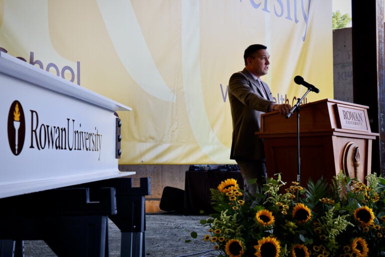 Dr. Matthew C. Edson speaking at a podium