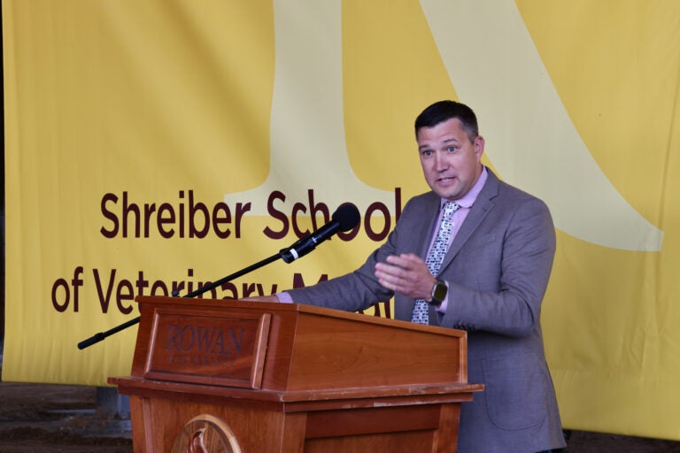 Dr. Matthew C. Edson speaking at a podium