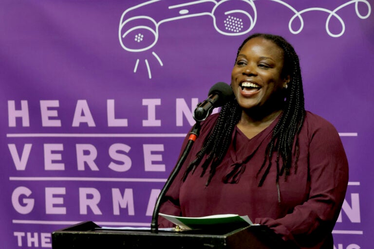 Stephanie Dockery speaking at a podium