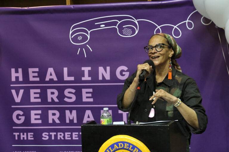 Ursala Rucker speaking at a podium