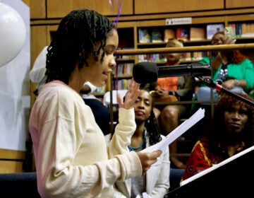 Zawadi Levy speaking at a podium