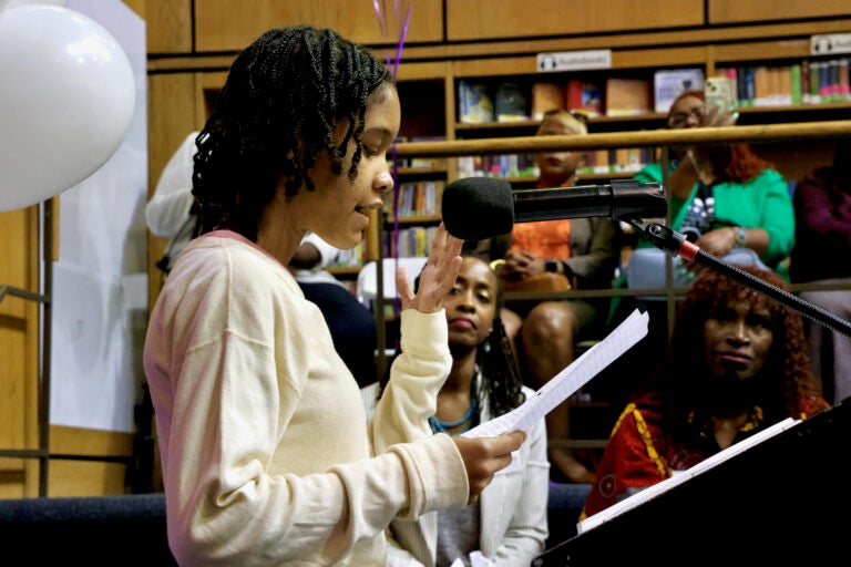 Zawadi Levy speaking at a podium