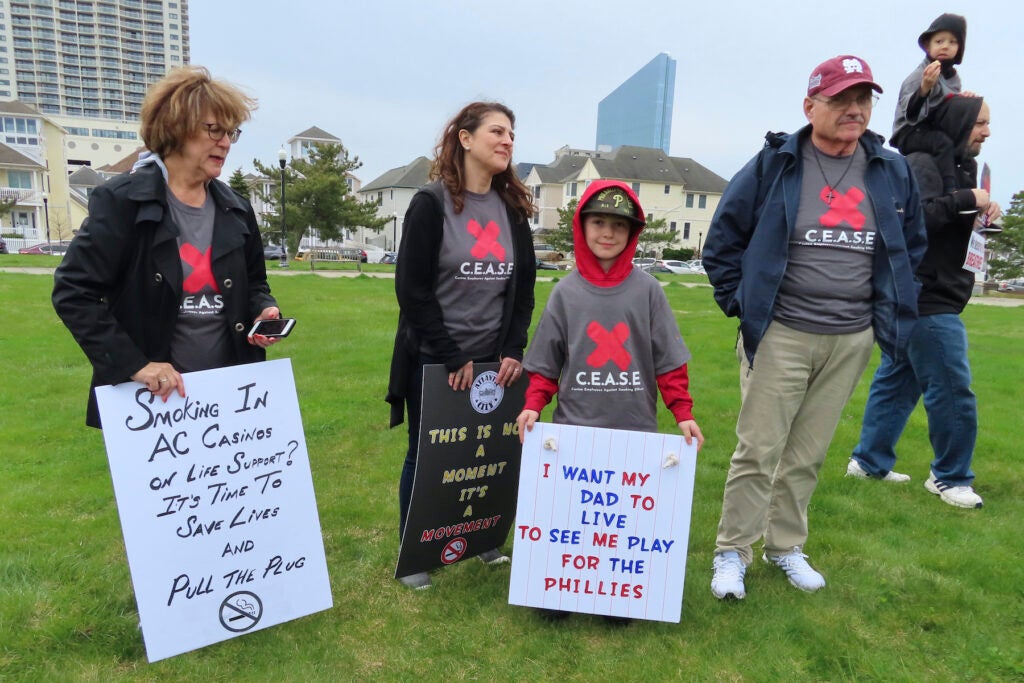 Family members of casino workers at a rally