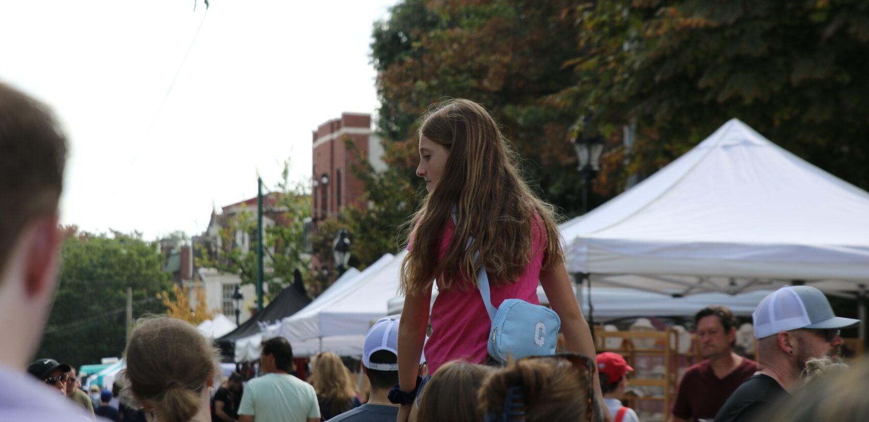 Thousands lined up and down Germantown Avenue for the 40th annual Chestnut Hill Fall For the Arts Festival on Sept. 15, 2024. (Cory Sharber/WHYY)