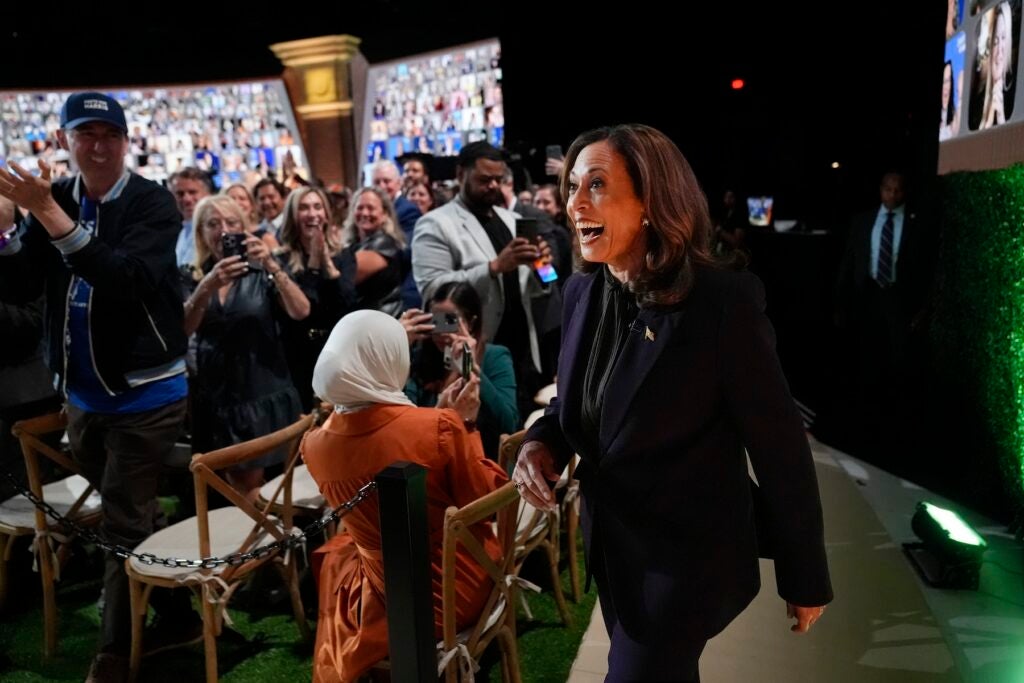 Kamala Harris walking onto the set with Oprah Winfrey