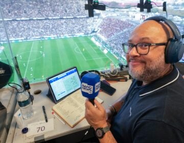 Marcelo do Ó smiles while working in press box