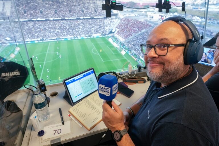 Marcelo do Ó smiles while working in press box