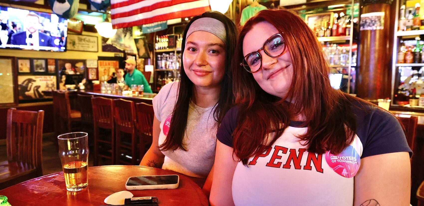 Lindsey McAnany and Kathryn Moriarity watch the presidential debate