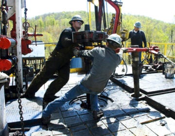 Workers at Chesapeake Energy natural gas well site