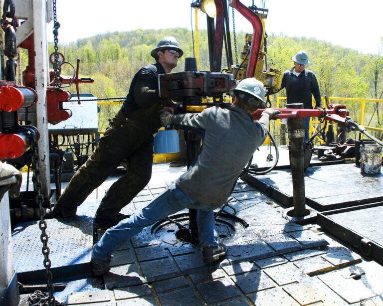 Workers at Chesapeake Energy natural gas well site