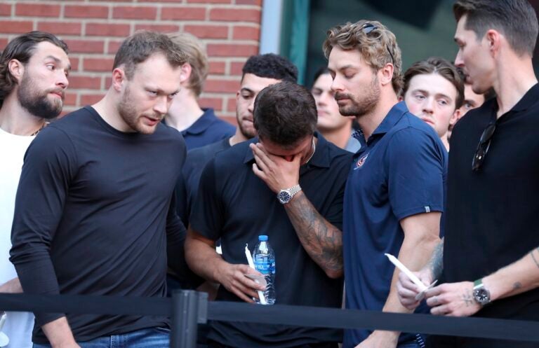 Columbus Blue Jackets players at vigil