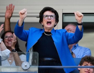 Billie Jean King stands and cheers