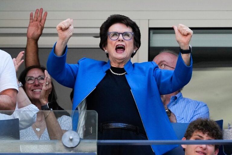 Billie Jean King stands and cheers