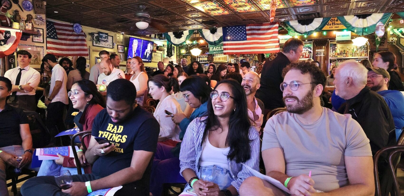 The crowd at McGillin’s Olde Ale House watches the Presidential debate.