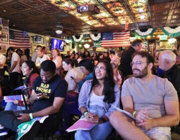 The crowd at McGillin’s Olde Ale House watches the Presidential debate.