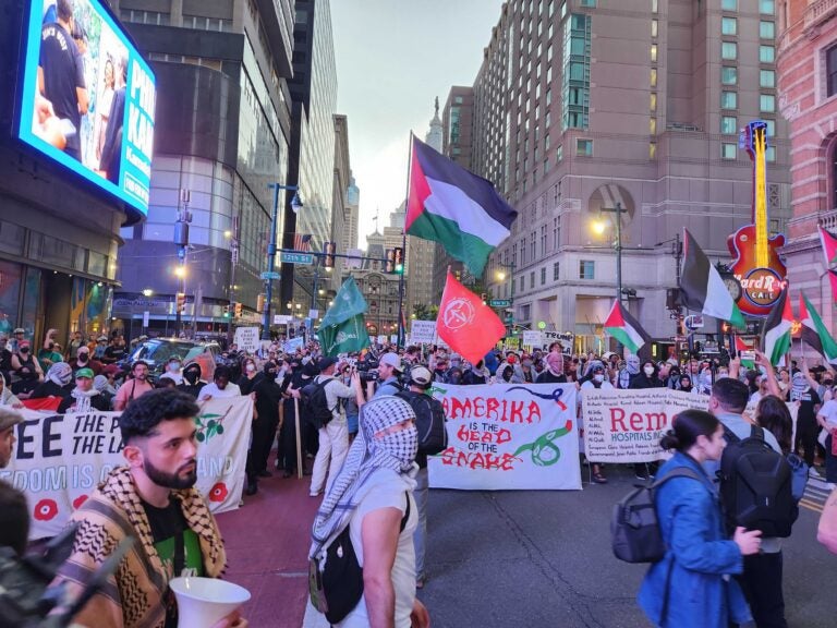 Pro-Palestinian protesters march on Market Street before the presidential debate. (Heather Chin/WHYY)