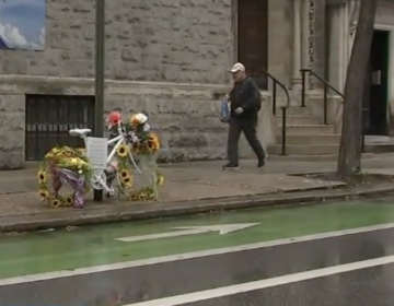 an Angel Bike with flowers sits as a memorial for Dr. Barbara Friedes