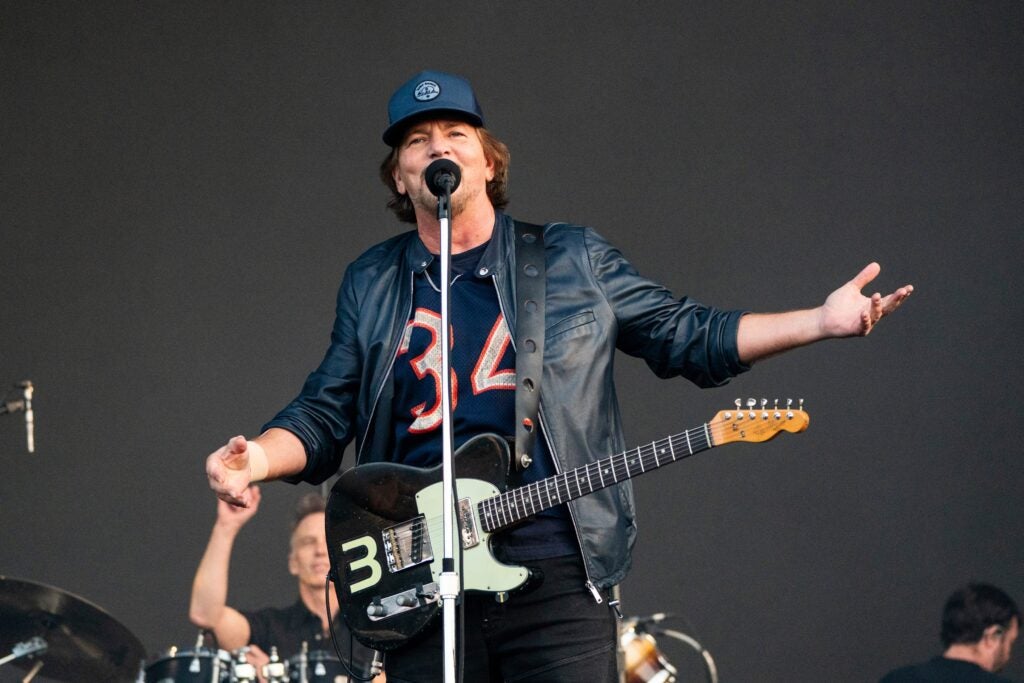 Eddie Vedder sings into a microphone