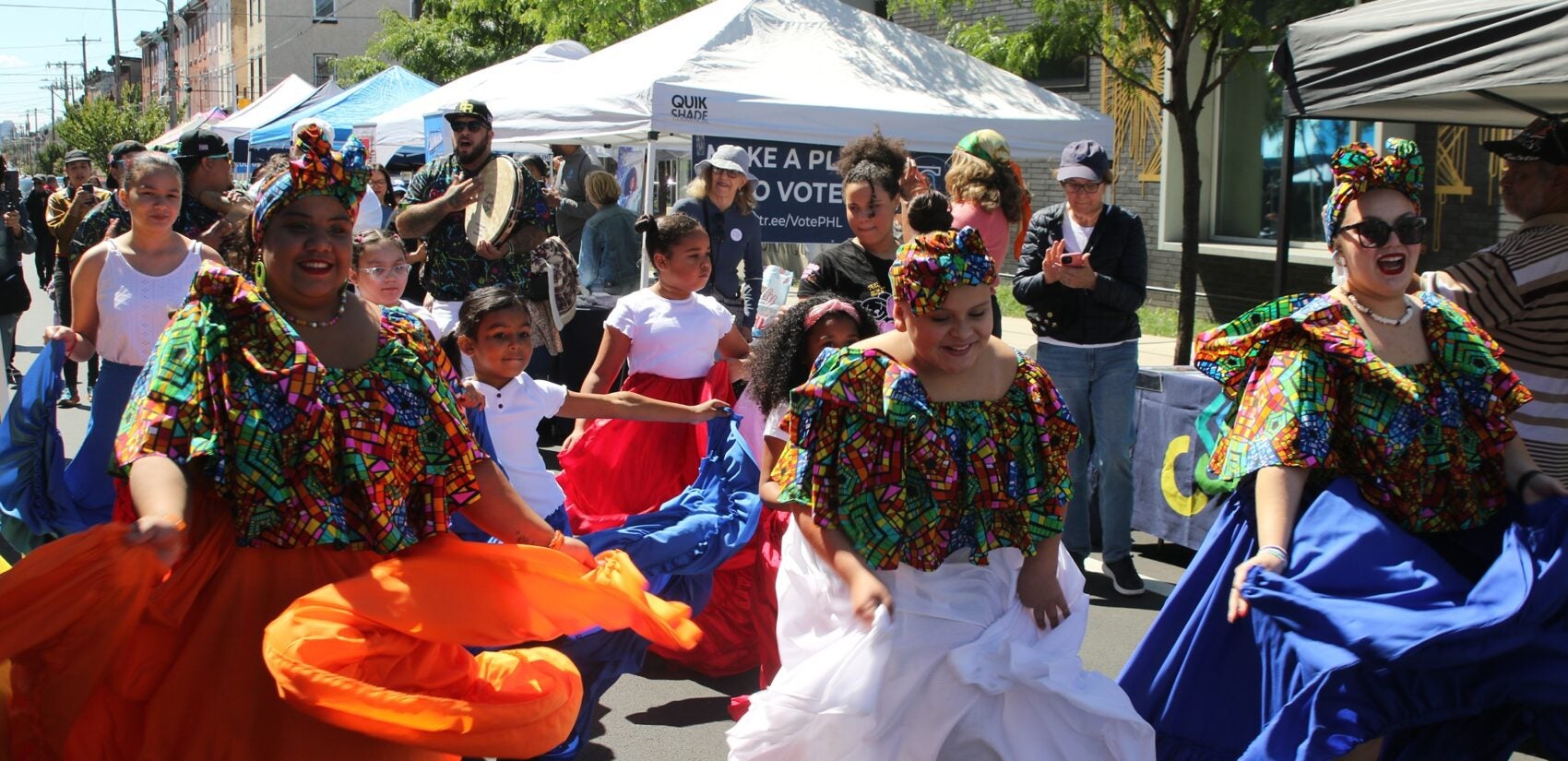 people dance in the street